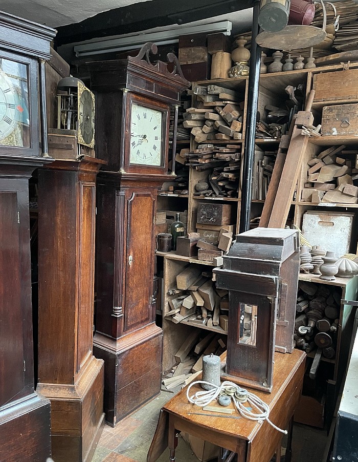 18th century longcase clocks being restored.